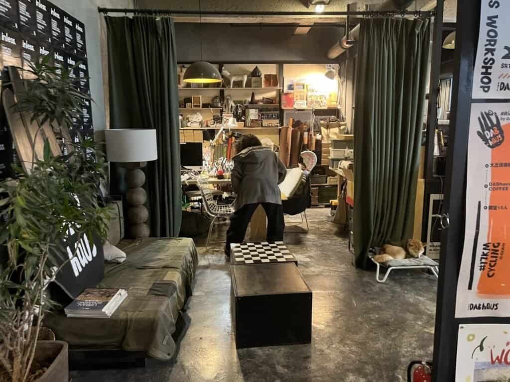 DAB haus craft on display, coffee beans, shelves, products, crafted goods, office, lady