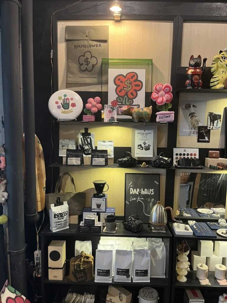 DAB haus craft on display, coffee beans, shelves, products, crafted goods, frisbee, cups,