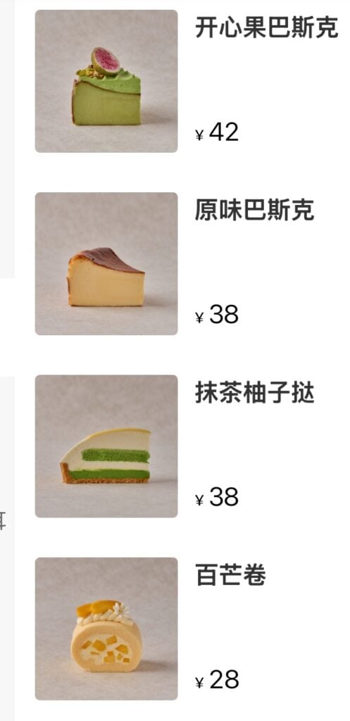 Variety of colorful cakes and pastries displayed on a menu at ThirstyGuide.