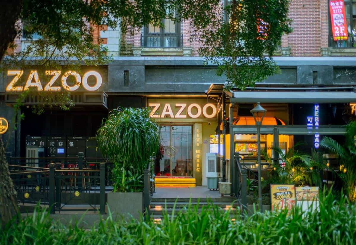 ZAZOO exterior with live music and kebab signs at Coco Park, Shenzhen bar street, photographed for thirstyguide.com.