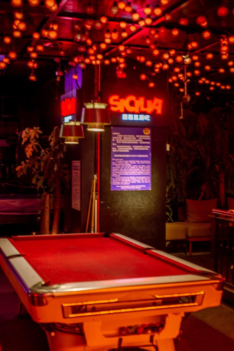 Pool table and neon sign at Scillia and Solo bar, thirstyguide.com